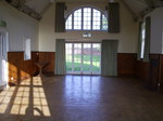 An internal photo from inside the hall towards a large window